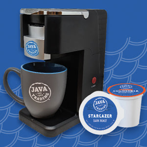Single cup coffee brewer with Java Trade logo and mug, and two k-cups on blue background