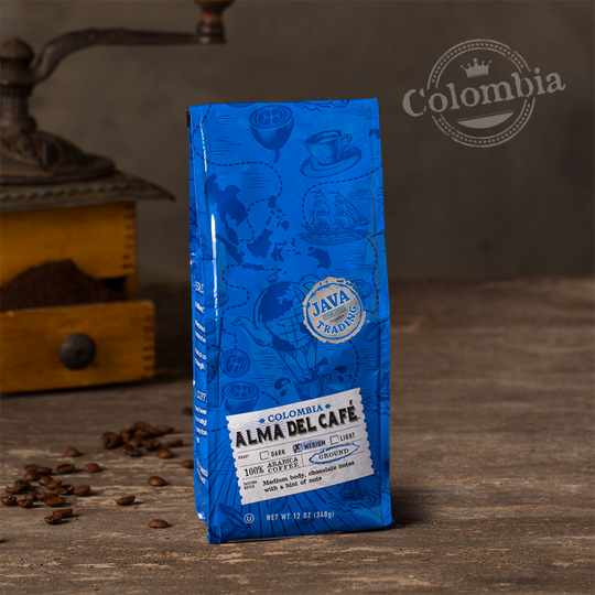 Bag of 12 ounce of Colombia Alma Del Café coffee on a wooden table