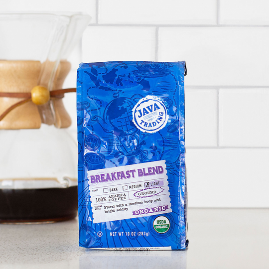 Bag of 10 ounce Organic Breakfast Blend coffee on a kitchen counter with pourover