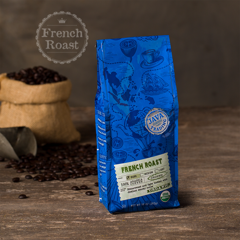 Bag of 10 ounce of Organic French Roast coffee on a wooden table with small burlap bag of roasted coffee beans